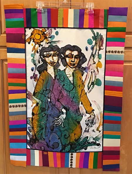 In progress batik panel art quilt, bordered with sari silk, by Judy Gula of Artistic Artifacts