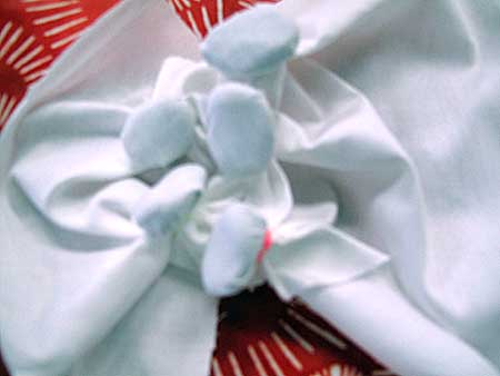 Shibori tied fabric ready for the indigo vat