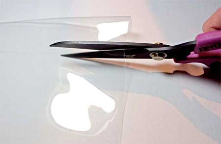 cutting the plastic with teflon scissors