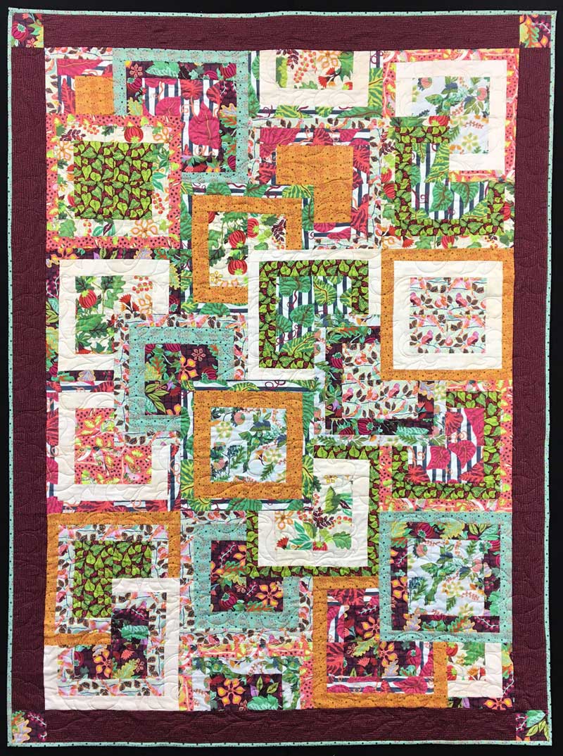 Completed Modern Squares quilt, designed and pieced by Christine Vinh, featuring Earth Made Paradise fabric from Kathy Doughty. Machine quilted by Sue Bentley