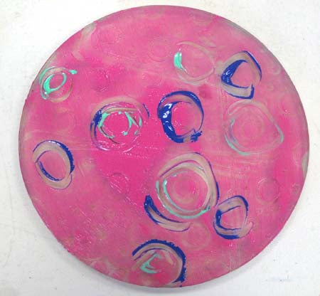 paint-covered plate with free-hand design