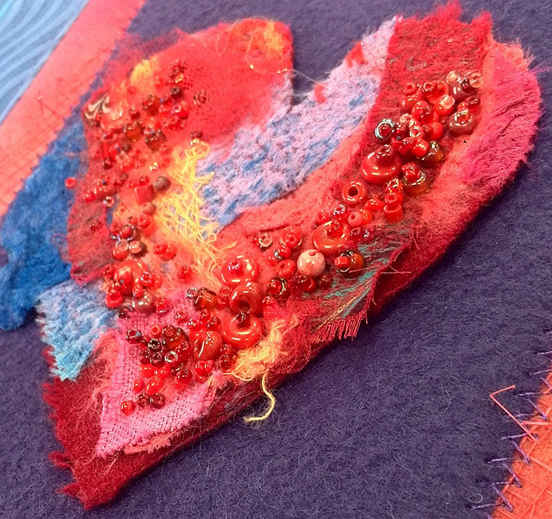 Detail, needlefelted and beaded heart Love art quilt by Judy Gula of Artistic Artifacts